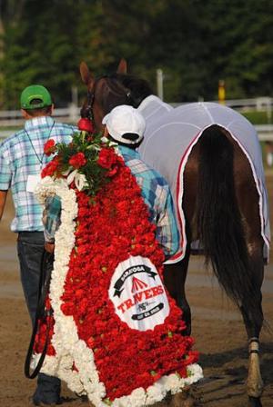WHAT IS THE OFFICIAL FLOWER OF THE TRAVERS STAKES (GI)?